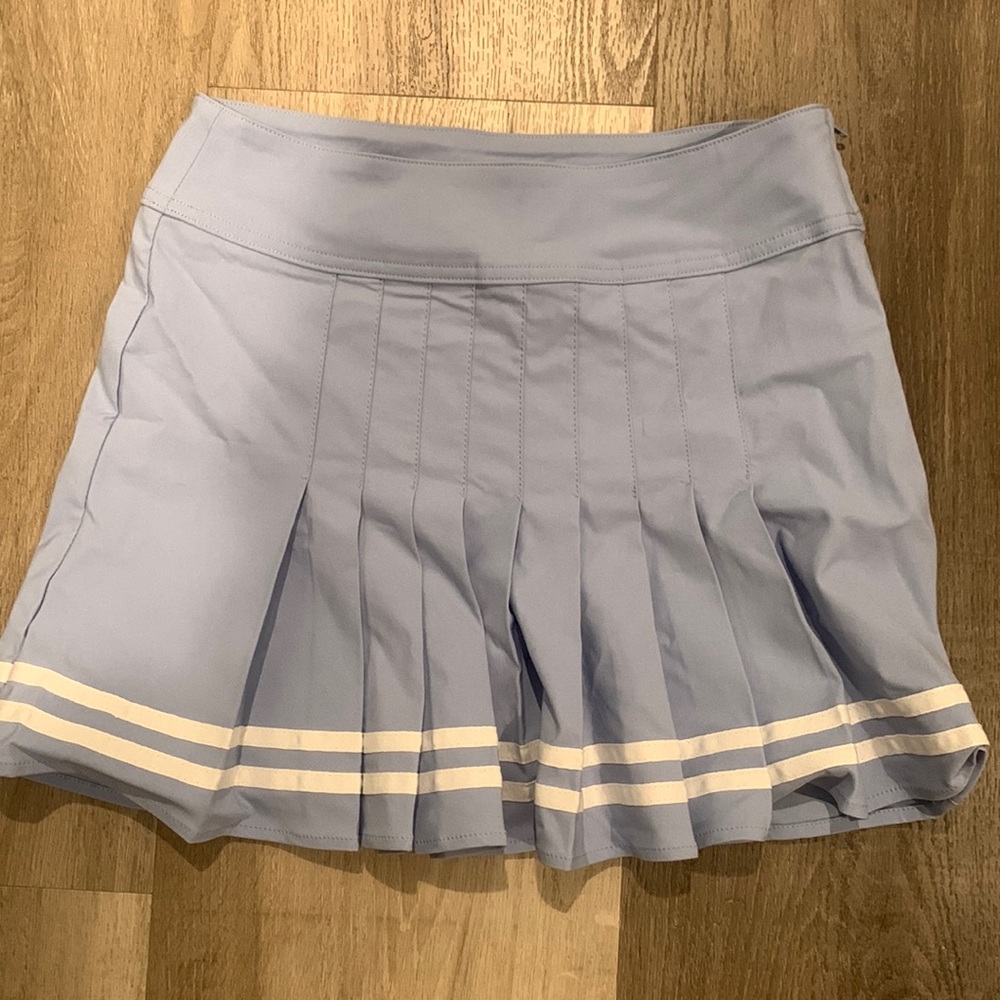 Blue and white pleaded skirt in the front and regular skirt In the back